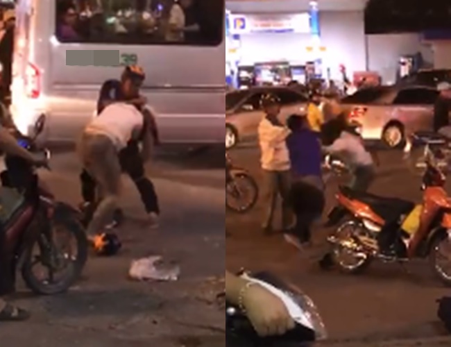 Hình ảnh đôi nam nữ lao vào đánh nhau ngay giữa phố. Ảnh cắt từ clip