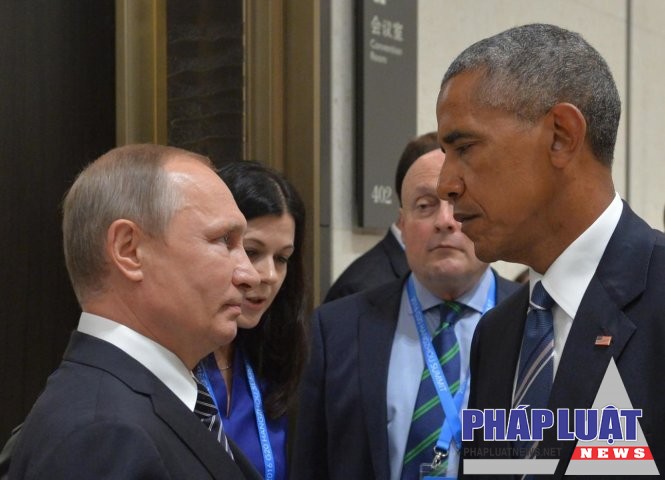 Tổng thống Nga Vladimir Putin (trái) và cựu tổng thống Mỹ Barrack Obama (phải) - Ảnh: AFP