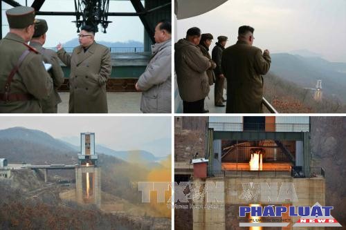 Nhà lãnh đạo Triều Tiên Kim Jong-un theo dõi một vụ thử động cơ tên lửa ở bãi phóng vệ tinh Sohae. Ảnh: Yonhap/TTXVN